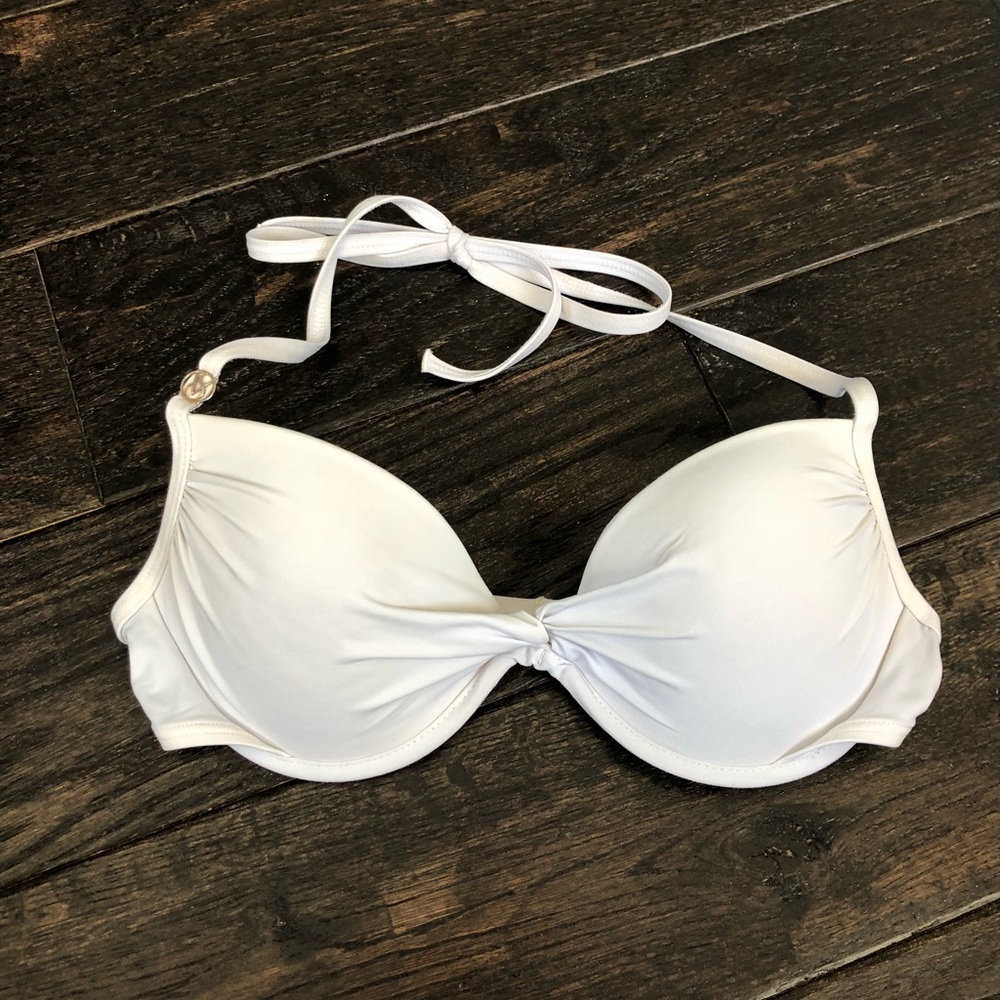 White Victoria Secret bathing suit top size 34B.